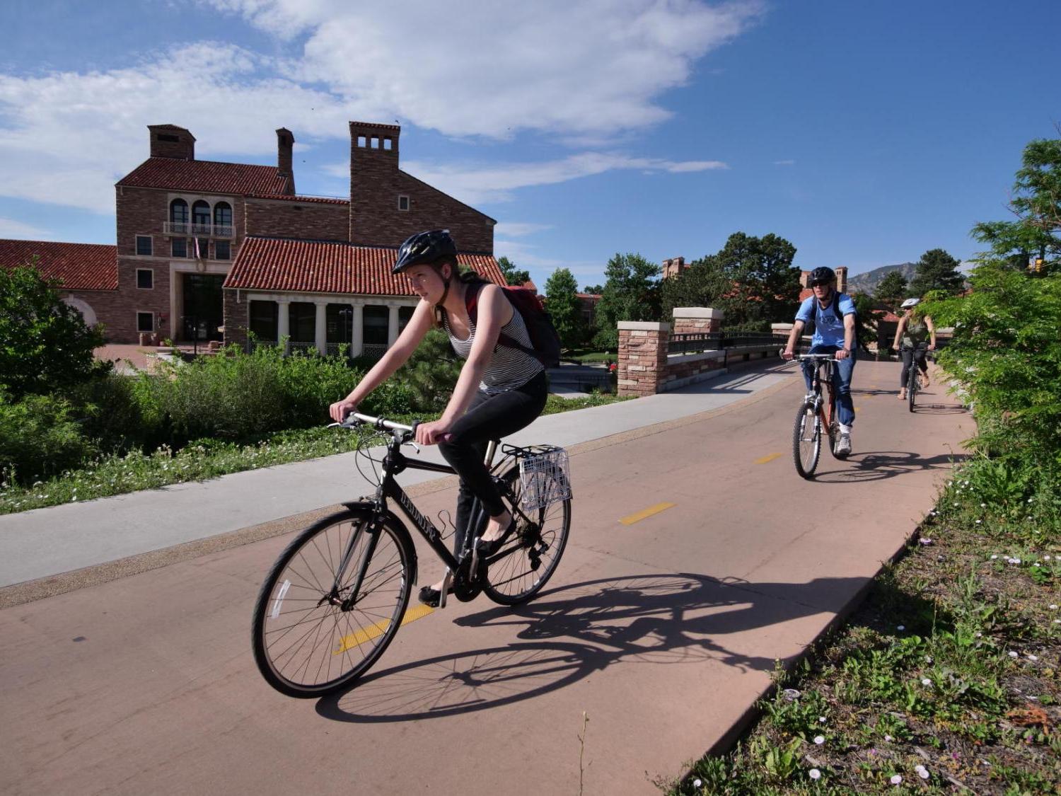 student biking on campus