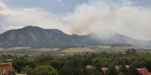 Smoke rises from the Flatirons in Boulder during the 2012 Flagstaff Fire.